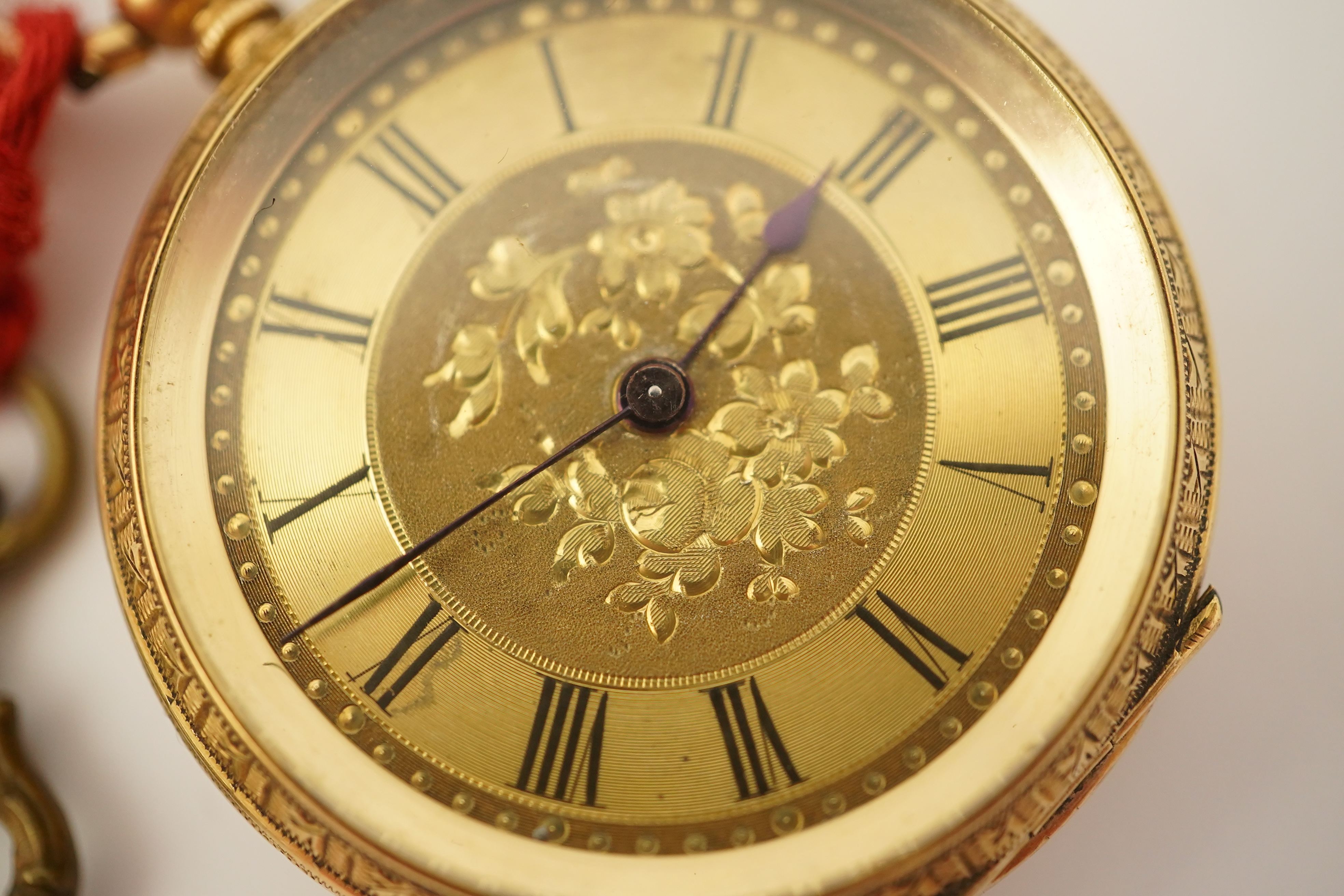 An early 20th century continental engraved 18k gold open faced fob watch